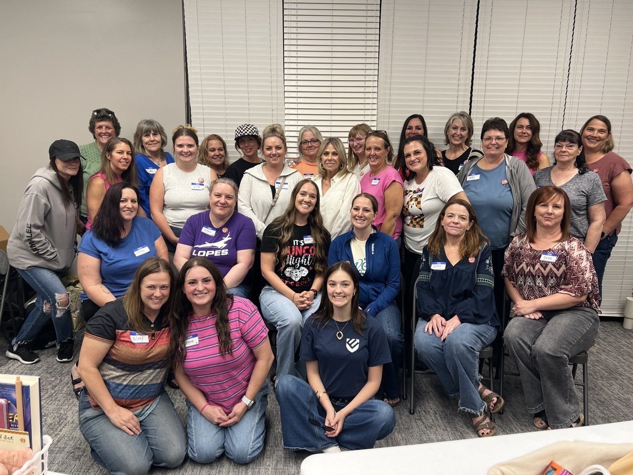 Friends gathered together for a Bunco night group photo