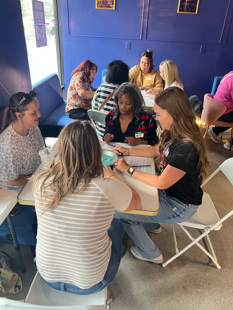 Women laughing together at bunco night