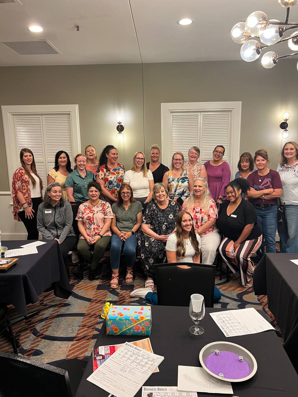 Women laughing together at bunco night